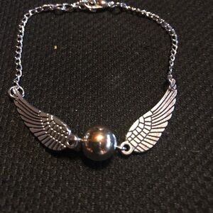 Super cute Harry Potter golden snitch inspired bracelet.
